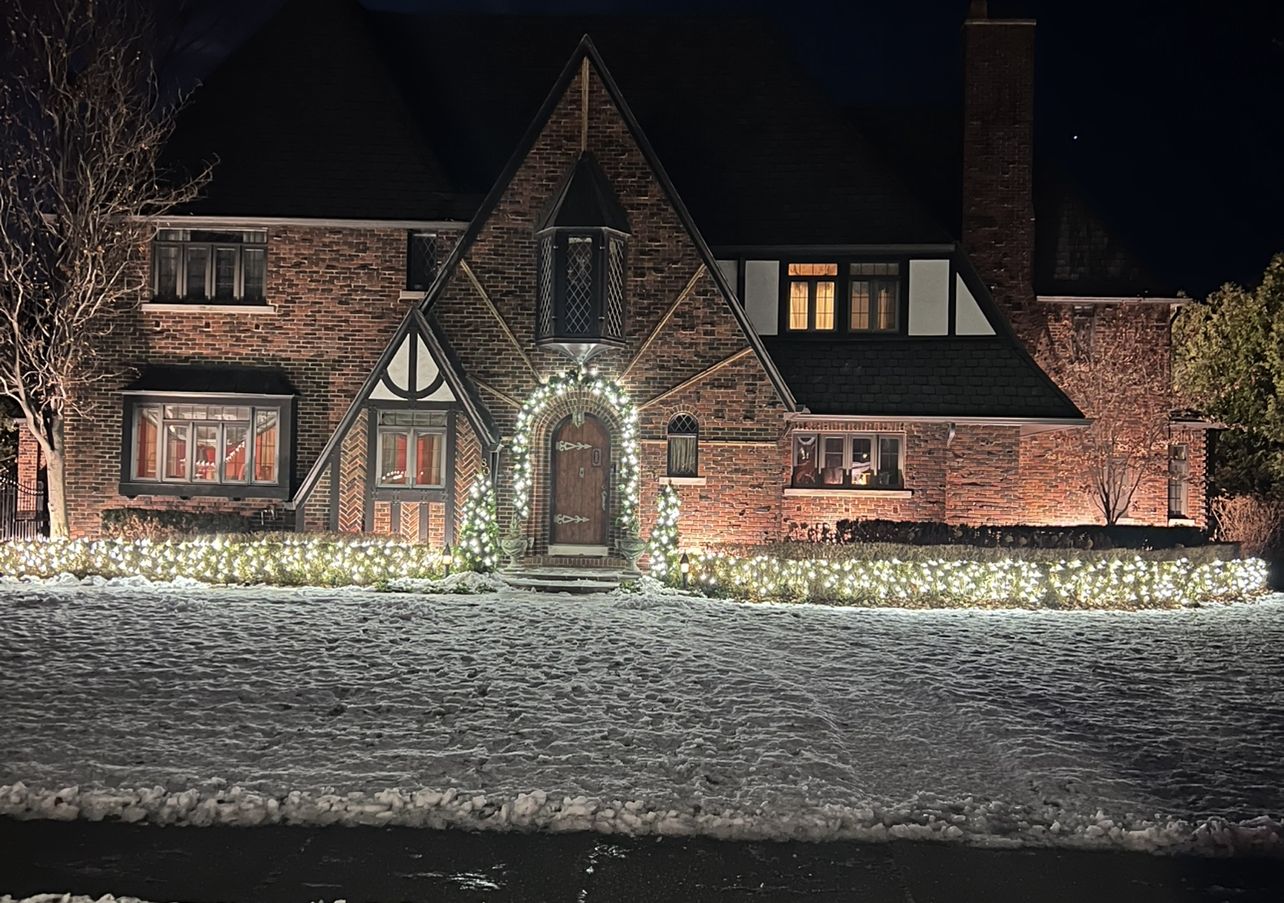 Lit garland arch entry with warm white hedge lighting, Grosse Pointe Shores